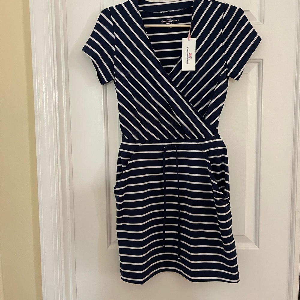 Brand new. Never worn with tags on. Great dress!